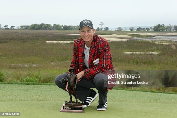 Jim Furyk celebrates with the trophy after winning on the second playoff hole at the RBC Heritage at Harbour Town Golf Links on April 19, 2015 in...