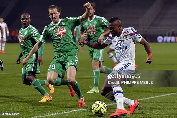 Saint-Etienne's French defender François Clerc vies with Lyon's French Cameroonian defender Henri Bedimo during the French L1 football match between...