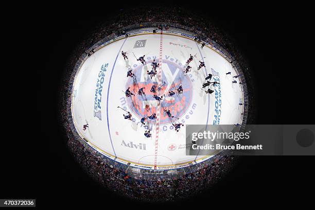 The New York Islanders celebrate a 2-1 overtime victory against the Washington Capitals in Game Three of the Eastern Conference Quarterfinals during...
