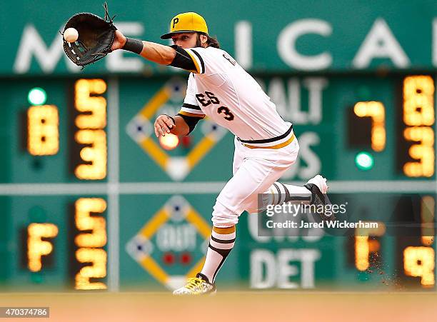 Sean Rodriguez of the Pittsburgh Pirates fields a ball at first base in the ninth inning against the Milwaukee Brewers during the game at PNC Park on...