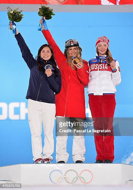 Silver medalist Tomoka Takeuchi of Japan, gold medalist Patrizia Kummer of Switzerland and bronze medalist Alena Zavarzina of Russia celebrate on the...