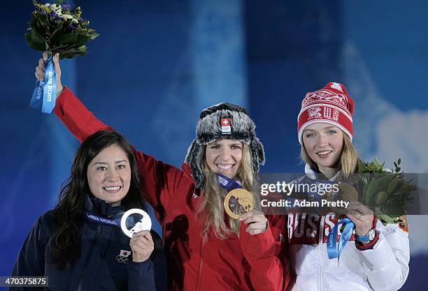 Silver medalist Tomoka Takeuchi of Japan, gold medalist Patrizia Kummer of Switzerland and bronze medalist Alena Zavarzina of Russia celebrate on the...