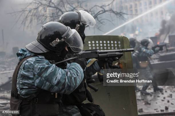 Berkut riot police shoot rubber bullets toward anti-government protesters on Independence Square on February 19, 2014 in Kiev, Ukraine. After several...