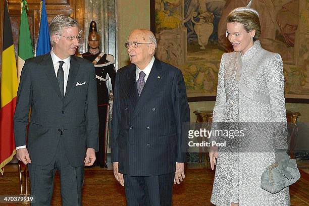 King Philippe and Queen Mathilde of Belgium greet Italian President Giorgio Napolitano as they arrive at Quirinale Palace on February 19, 2014 in...