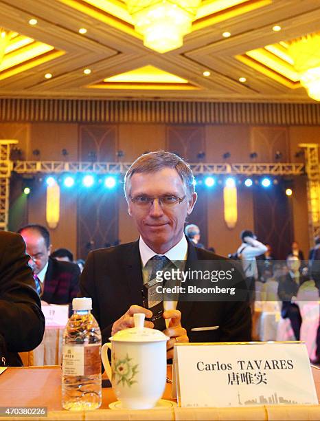 Carlos Tavares, chief executive officer of PSA Peugeot Citroen, attends a joint news conference with Xu Ping, chairman of Dongfeng Motor Group Co.,...
