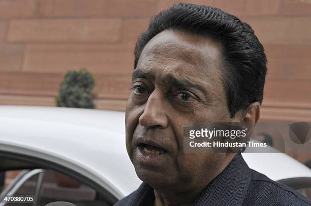 Parliamentary Affairs Minister Kamal Nath speaks with media person after attending Lok Sabha session at Parliament House on February 19, 2014 in New...