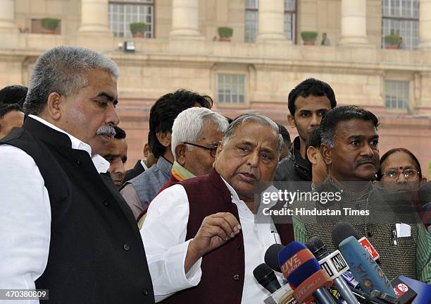 Samajwadi Party Chief Mulayam Singh Yadav speaks with media person on the after attending Parliament session on February 19, 2014 in New Delhi,...