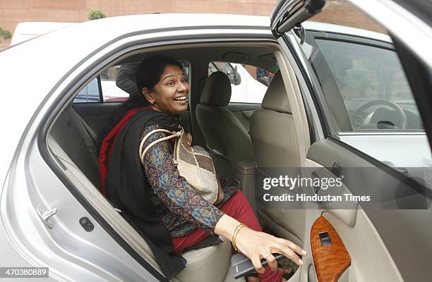 Kanimozhi leaves after attending Parliament session on February 19, 2014 in New Delhi, India. Lok Sabha adjourned for the day amid uproar over...