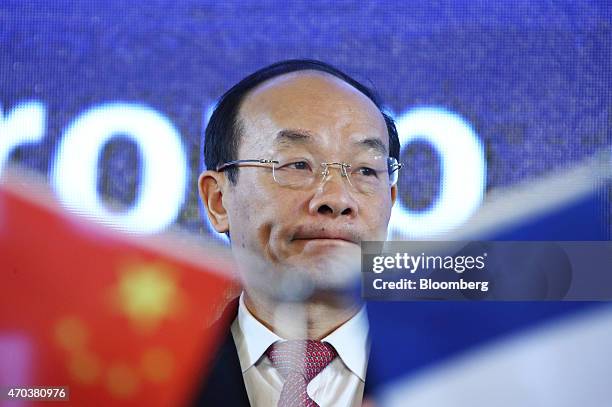 Xu Ping, chairman of Dongfeng Motor Group Co., attends a joint news conference with Carlos Tavares, chief executive officer of PSA Peugeot Citroen,...