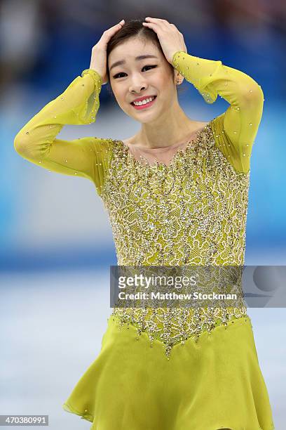 Yuna Kim of South Korea reacts after competing in the Figure Skating Ladies' Short Program on day 12 of the Sochi 2014 Winter Olympics at Iceberg...