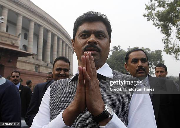 Rajya Sabha MP CM Rameshi gestures to media after attending the Parliament session on February 19, 2014 in New Delhi, India. Lok Sabha adjourned for...