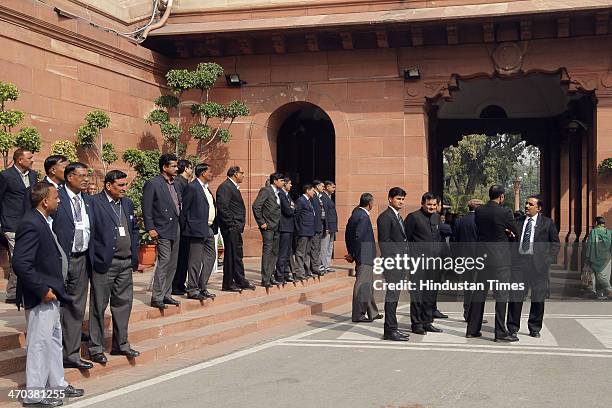Security officers keep vigil at Parliament House during parliament session on February 19, 2014 in New Delhi, India. Lok Sabha adjourned for the day...