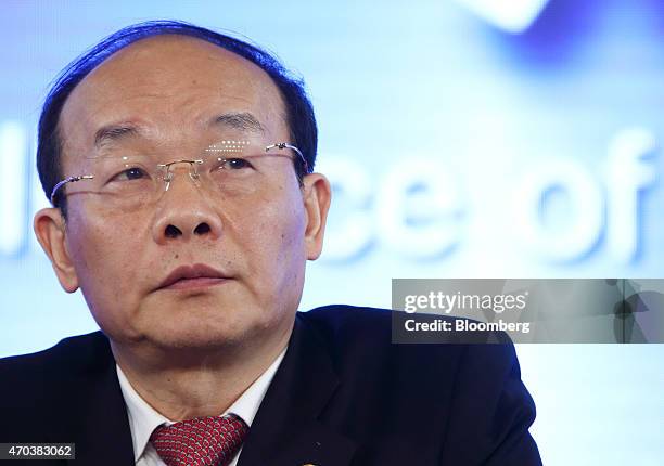 Xu Ping, chairman of Dongfeng Motor Group Co., attends a joint news conference with Carlos Tavares, chief executive officer of PSA Peugeot Citroen,...