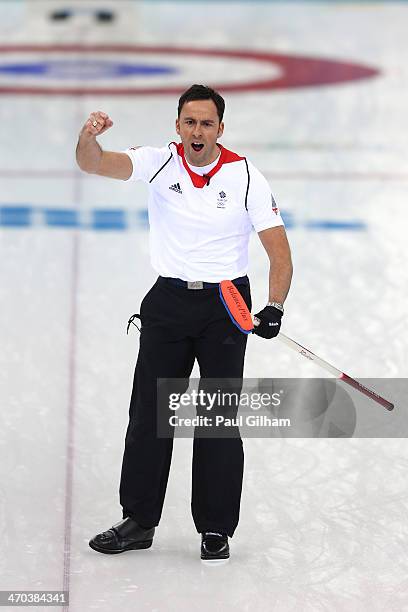 David Murdoch of Great Britain celebrates winning with the final stone in the men's semifinal match between Sweden and Great Britain at Ice Cube...