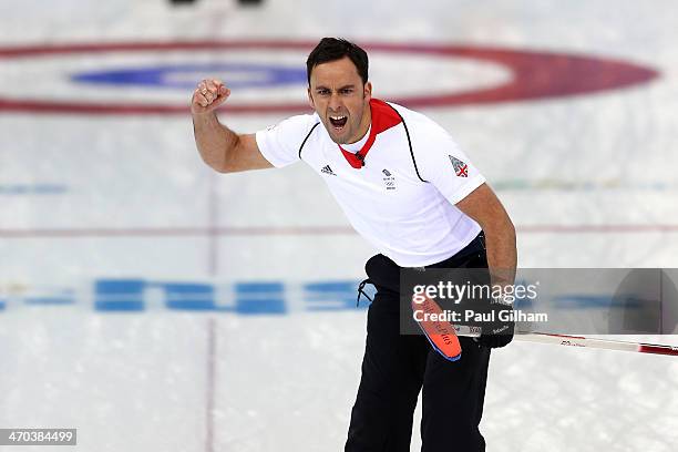 David Murdoch of Great Britain celebrates winning with the final stone in the men's semifinal match between Sweden and Great Britain at Ice Cube...