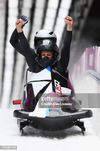 Jamie Greubel and Aja Evans of the United States team 2 celebrate during the Women's Bobsleigh on Day 12 of the Sochi 2014 Winter Olympics at Sliding...