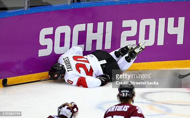 John Tavares of Canada dives into the boards during the Men's Ice Hockey Quarterfinal Playoff against Latvia on Day 12 of the 2014 Sochi Winter...
