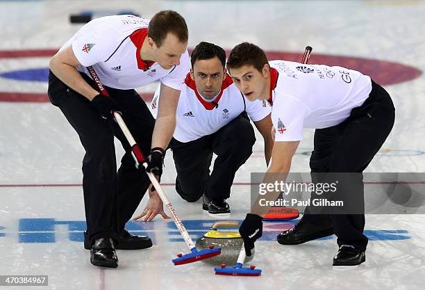 David Murdoch of Great Britain looks on as he releases the final stone to win the match in the men's semifinal match between Sweden and Great Britain...