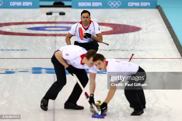 David Murdoch of Great Britain looks on as he releases the final stone to win the match in the men's semifinal match between Sweden and Great Britain...