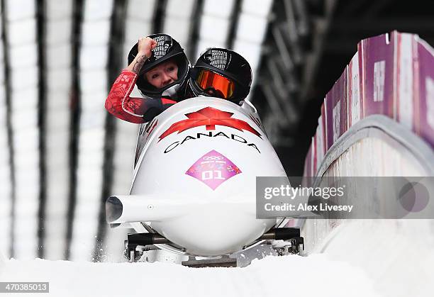 Kaillie Humphries and Heather Moyse of Canada team 1 celebrate winning the gold medal during the Women's Bobsleigh on Day 12 of the Sochi 2014 Winter...