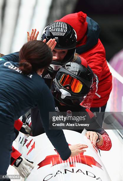 Kaillie Humphries and Heather Moyse of Canada team 1 celebrate winning the gold medal during the Women's Bobsleigh on Day 12 of the Sochi 2014 Winter...
