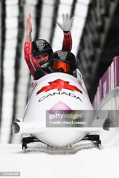 Kaillie Humphries and Heather Moyse of Canada team 1 celebrate as the cross the finsih line during the Women's Bobsleigh on Day 12 of the Sochi 2014...