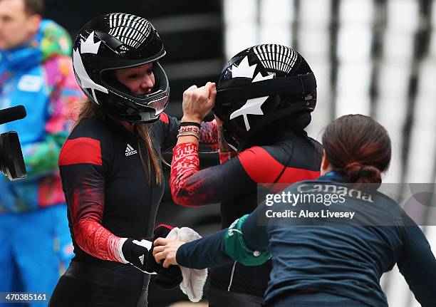 Kaillie Humphries and Heather Moyse of Canada team 1 celebrate before winning the gold medal during the Women's Bobsleigh on Day 12 of the Sochi 2014...