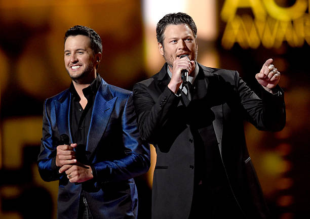 Co-hosts Luke Bryan and Blake Shelton speak onstage during the 50th Academy of Country Music Awards at AT&T Stadium on April 19, 2015 in Arlington,...