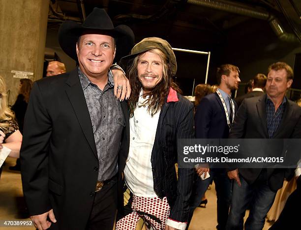 Honoree Garth Brooks and recording artist Steven Tyler pose backstage at the 50th Academy of Country Music Awards at AT&T Stadium on April 19, 2015...