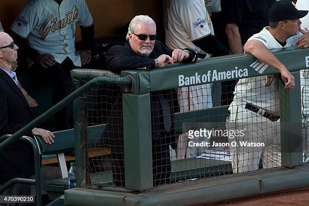 Brian Sabean of the San Francisco Giants stands in the dugout during the 2014 World Series ring ceremony before the game against the Arizona...