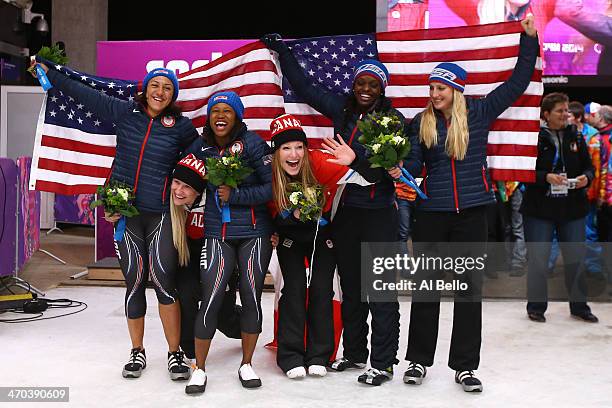 Gold medallists Kaillie Humphries and Heather Moyse of Canada team 1 pose with silver medallists Elana Meyers and Lauryn Williams of the United...