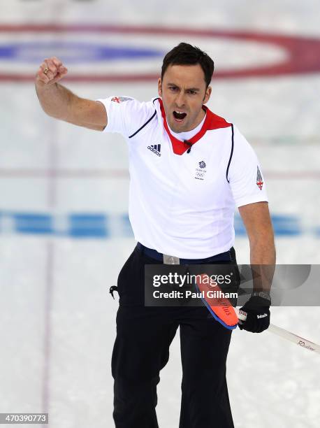 David Murdoch of Great Britain celebrates winning with the final stone in the men's semifinal match between Sweden and Great Britain at Ice Cube...