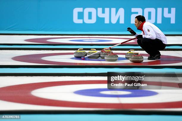 David Murdoch of Great Britain lines up a move with his team-mates during the men's semifinal match between Sweden and Great Britain at Ice Cube...