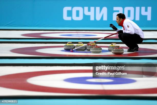 David Murdoch of Great Britain lines up a move with his team-mates during the men's semifinal match between Sweden and Great Britain at Ice Cube...