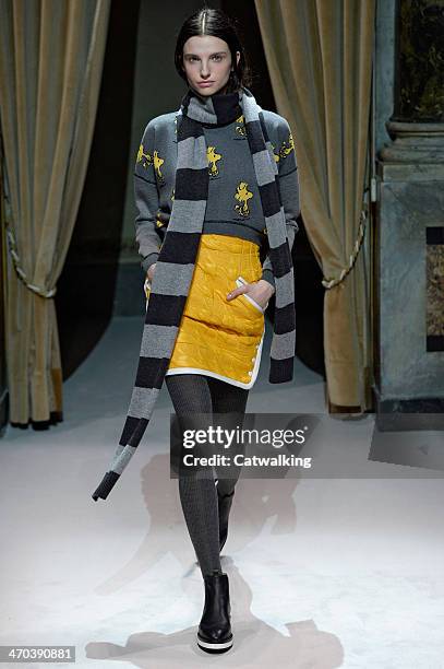 Model walks the runway at the Fay Autumn Winter 2014 fashion show during Milan Fashion Week on February 19, 2014 in Milan, Italy.