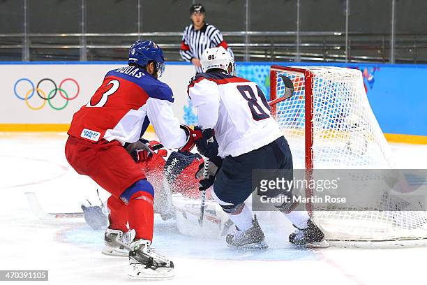Phil Kessel of the United States scores his team's fifth goal against Alexander Salak of the Czech Republic in the third period during the Men's Ice...