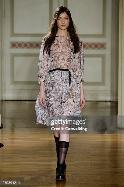 Model walks the runway at the Frankie Morello Autumn Winter 2014 fashion show during Milan Fashion Week on February 19, 2014 in Milan, Italy.