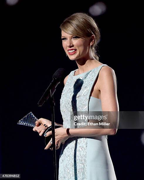 Honoree Taylor Swift accepts the 50th Anniversary Milestone Award for Youngest ACM Entertainer of the Year onstage during the 50th Academy of Country...