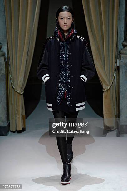 Model walks the runway at the Fay Autumn Winter 2014 fashion show during Milan Fashion Week on February 19, 2014 in Milan, Italy.