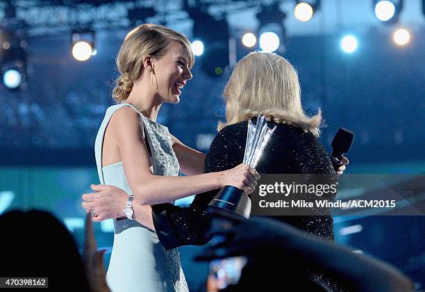 Honoree Taylor Swift accepts the Milestone Award from Andrea Finlay onstage during the 50th Academy of Country Music Awards at AT&T Stadium on April...