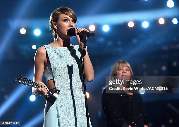 Honoree Taylor Swift accepts the 50th Anniversary Milestone Award from Andrea Swift onstage during the 50th Academy of Country Music Awards at AT&T...