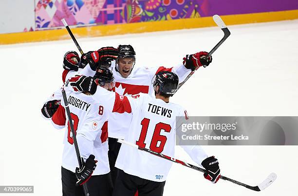 Shea Weber of Canada celebrates with teammates Drew Doughty, Ryan Getzlaf and Jonathan Toews after scoring a third period goal against Latvia during...