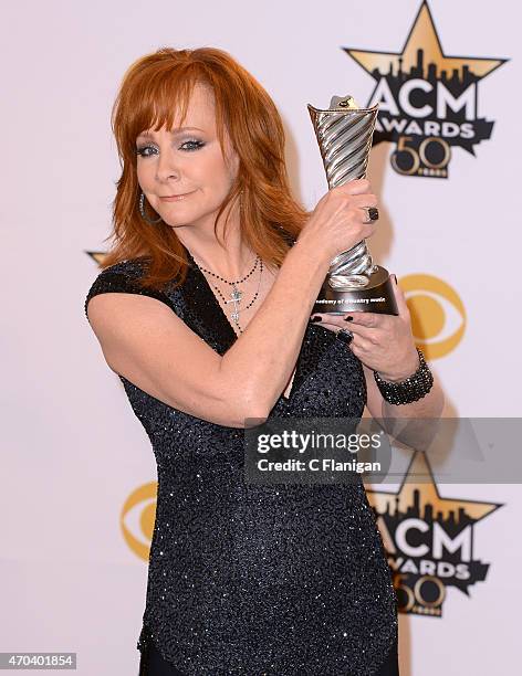 Honoree Reba McEntire, recipient of the Milestone Award for Most Awarded ACM Female Vocalist Of The Year poses in the press room at the 50th Academy...