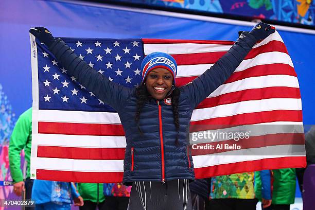 Aja Evans of the United States team 2 celebrates after winning the bronze medal during the Women's Bobsleigh on Day 12 of the Sochi 2014 Winter...