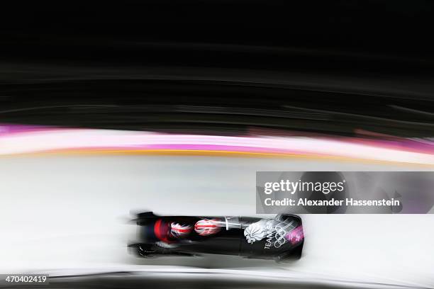 Paula Walker and Rebekah Wilson of Great Britain team 1 make a run during the Women's Bobsleigh on Day 12 of the Sochi 2014 Winter Olympics at...