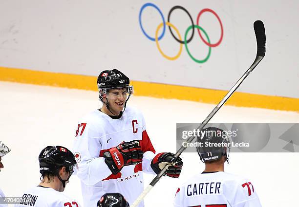 Duncan Keith, Sidney Crosby and Jeff Carter of Canada celebrate after defeating Latvia 2-1 during the Men's Ice Hockey Quarterfinal Playoff on Day 12...