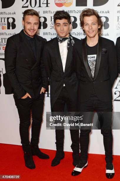 Liam Payne, Zayn Malik and Louis Tomlinson of One Direction attend The BRIT Awards 2014 at the 02 Arena on February 19, 2014 in London, England.