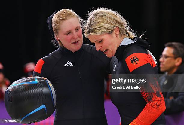 Sandra Kiriasis and Franziska Fritz of Germany team 1 talk during the Women's Bobsleigh on Day 12 of the Sochi 2014 Winter Olympics at Sliding Center...