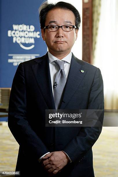 Ichiro Ino, chief executive of Asia Pacific at Hitachi Ltd., poses for a photograph following a Bloomberg Television interview at the World Economic...