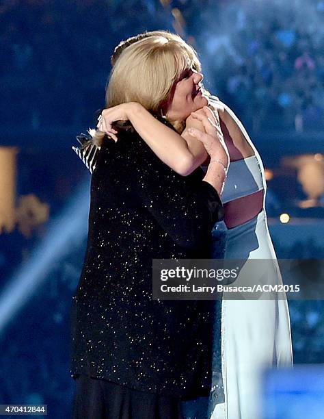 Andrea Swift and honoree Taylor Swift onstage during the 50th Academy of Country Music Awards at AT&T Stadium on April 19, 2015 in Arlington, Texas.